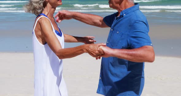 Senior couple hugging each other at the beach