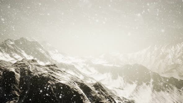 Heavy Snowing, Focused on the Snowflakes, Mountains in the Background alt