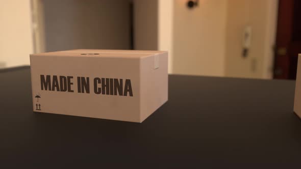 Boxes with MADE IN CHINA Text on Conveyor