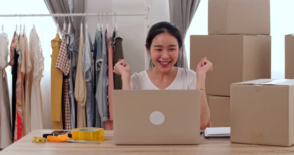 Young Asian Woman Entrepreneur Celebrate With Laptop