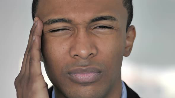 Close Up of Stressed Man Face with Headache