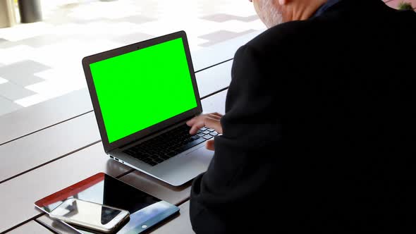 Businessman using laptop in hotel 4k