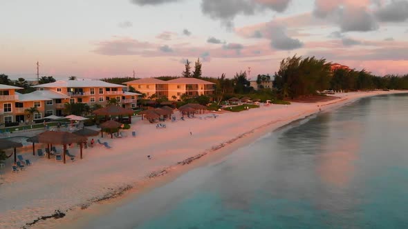 Drone flying at sunset near Seven Mile Beach in the Cayman Islands