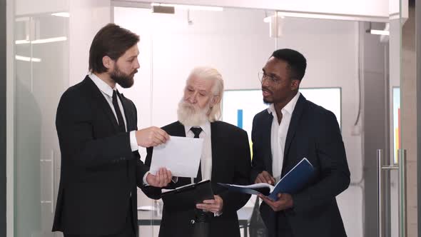 Three Smiling Diverse Business Colleagues Having Business Strategy Meeting