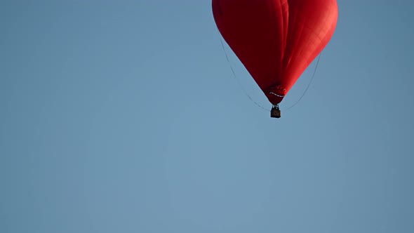 Colorful Hotair Heart Shape Balloon Flying on Sunset Over Blue Sky in Slow Motion Happy Valentines