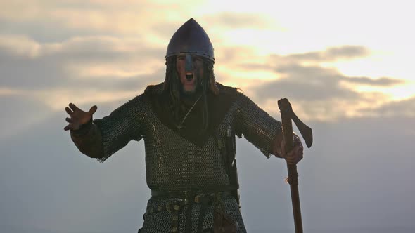 Viking is screams emotionally looking ar the camera. Battle cry