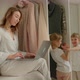 Girl with a Laptop Sits on the Closet and Looks at the Playing Children - VideoHive Item for Sale