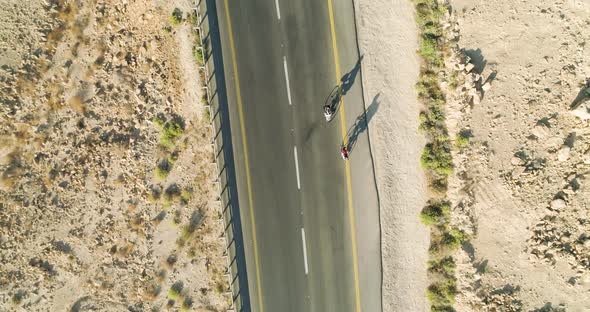 Aerial view of two person on bicycle, Mizpe Ramon, Israel.