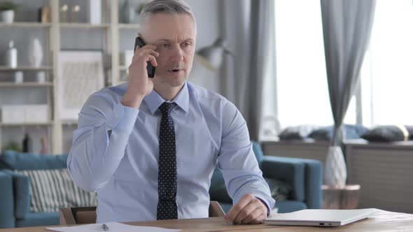 Gray Hair Businessman Talking on Phone