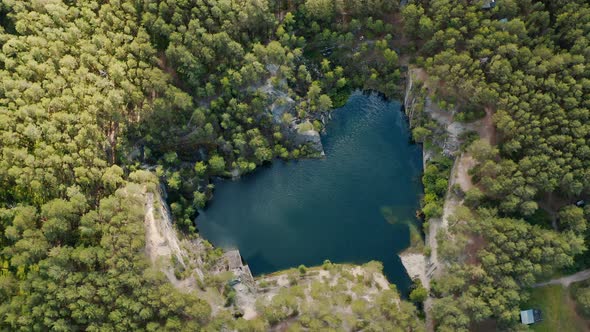 Aerial view of blue teal lake and green Crystal clear mountain lake water surface