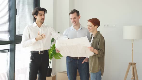 Handsome Male Real Estate in Formal Wear Stand Talking with Customers