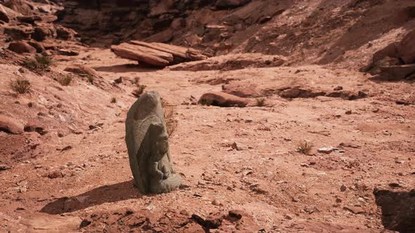 Ancient Statue on the Rocks Desert