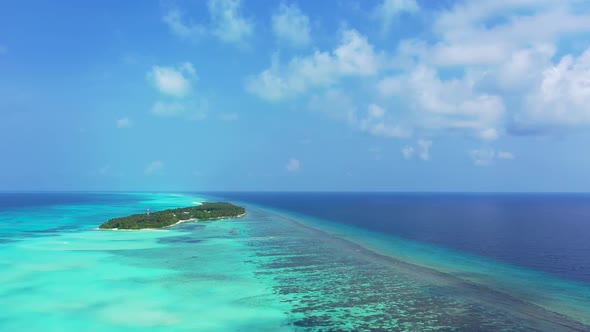 Aerial drone nature of idyllic seashore beach vacation by blue ocean and white sandy background of a