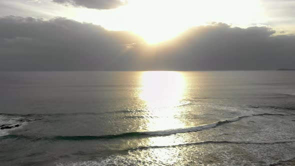 Aerial shot of the sun setting over the coastline of bass coast Victoria Australia.