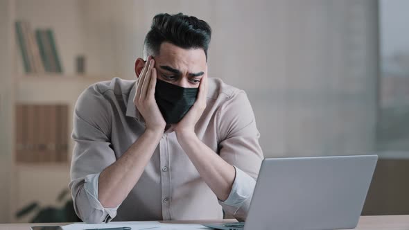 Bored Tired Hispanic Guy Worker in Medical Mask During Pandemic Coronavirus Young Business Man Tired