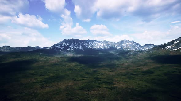 Mountains with Snow Capped Peaks in Summer