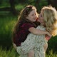 Young Woman and Child Hugging in Field - VideoHive Item for Sale