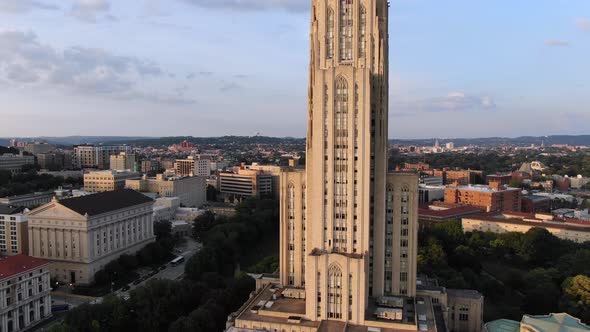 An aerial zoom out establishing shot of the Cathedral of Learning on Pitt's campus in Pittsburgh's O