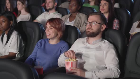 Young Couple Enjoying Movie Cinema