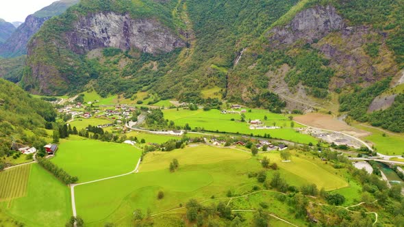 Flying over Beautiful meadows near the foothills of a mountain