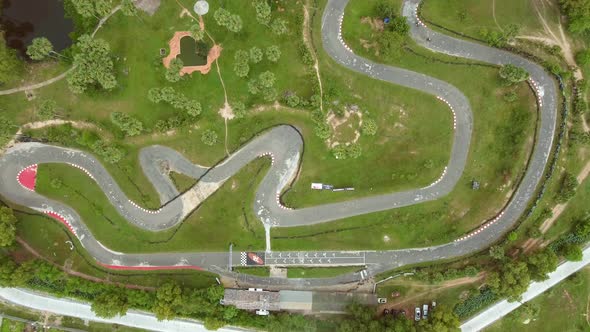 Faraway aerial view of a group driving kart on a speedway, Cambodia.