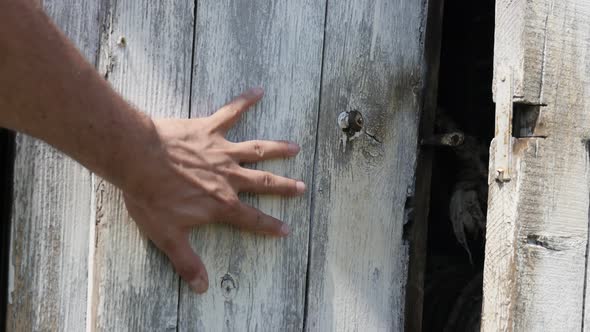 Hand opens doors of water well 4k footage