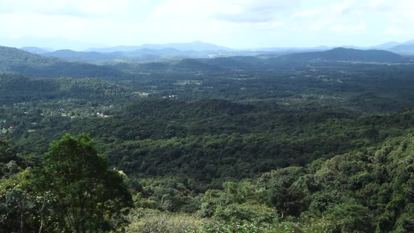 mountainscape with immense lush tropical rainforest in Brazil, trucking shot