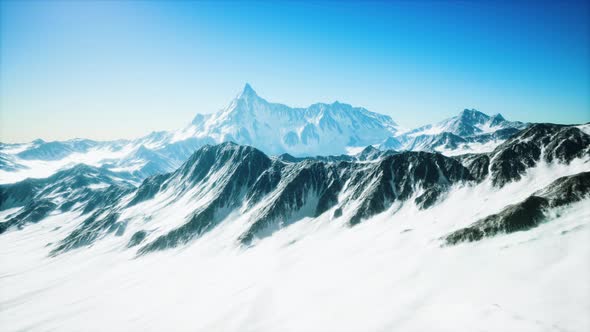 Mountain Winter Caucasus Landscape with White Glaciers and Rocky Peak