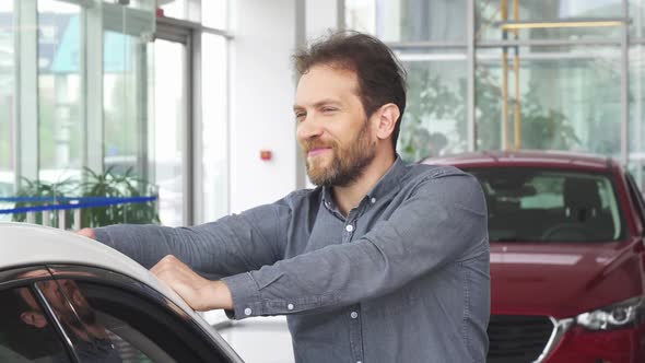 Mature Happy Handsome Man Posing with His New Automobile