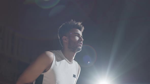 Young Basketball Player Shooting Ball