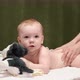 The masseuse gives a back and buttocks massage to baby (boy) 09 - VideoHive Item for Sale