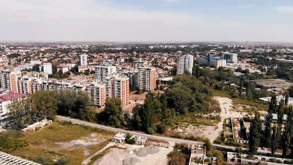 Slow motion cinematic color graded footage of town building by the river.