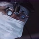 Doctor with surgical loupe looking at camera - VideoHive Item for Sale