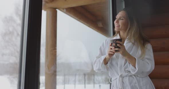 Beauty and Healthcare Woman with Cup Near Window at Home