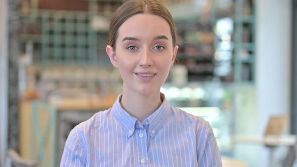 Portrait of Smiling Young Businesswoman Looking at Camera 