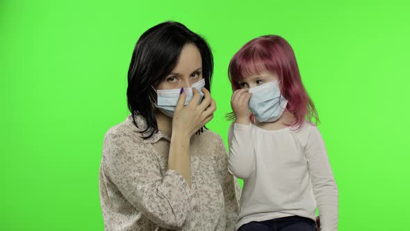 Sick Mother and Daughter in Medical Mask. Coronavirus Concept. Family Quarantine