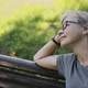 A Woman Sitting on a Park Bench - VideoHive Item for Sale