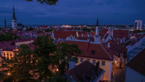 Time lapse view of the old town of Tallinn at night. Beautiful dusk light over the city in Estonia.