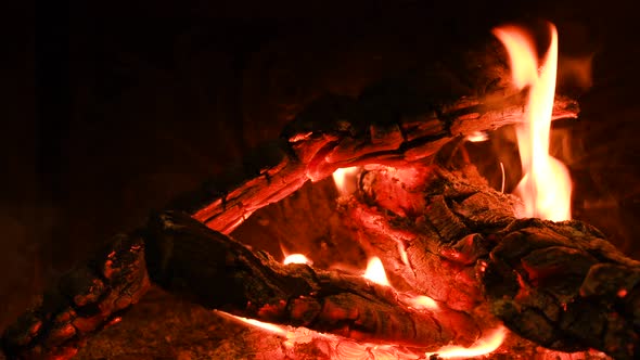 Warm Cozy Burning Fire in a Brick Fireplace Closeup Shot