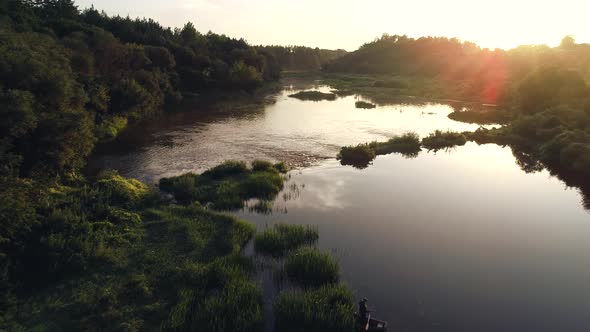 Man Fishing On River