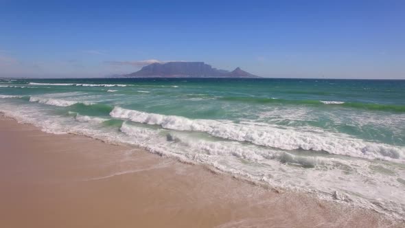 Aerial travel drone view of Table Mountain, Table Bay from Bloubergstrand, Cape Town, South Africa.