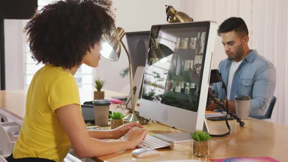 Two colleagues working in creative office