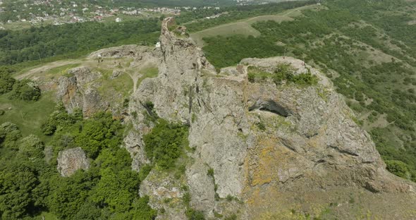 Rocky ruins of the medieval Azeula Fortress against the Kojori townscape.