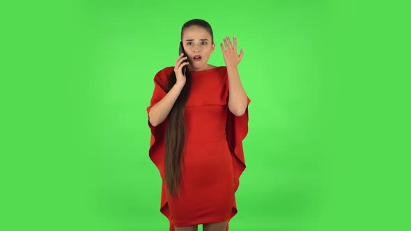 Pretty Young Woman Is Upset Speaking on the Phone, Proving Something. Green Screen