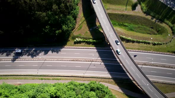 Traffic On Highway With Bridge Over Roads. Modern Rural Infrastructure.