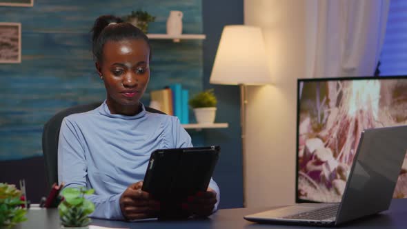 African American Businesswoman Taking Break Using Tablet