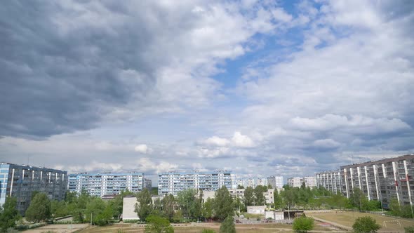 Clouds Move Over Multi-Storey Buildings in Residential Area of City. Timelapse