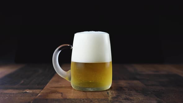 Pouring Beer Into Frosty Glass Mug