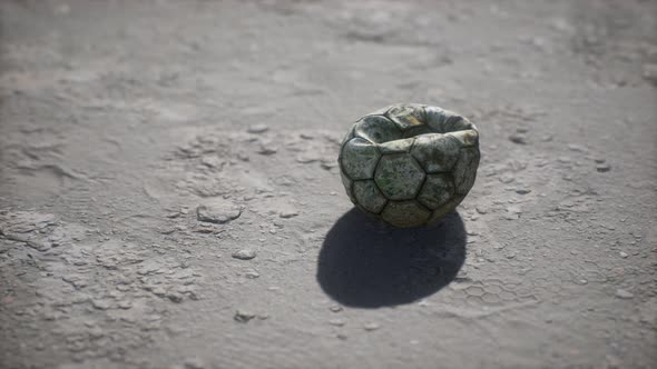 Old Soccer Ball the Cement Floor