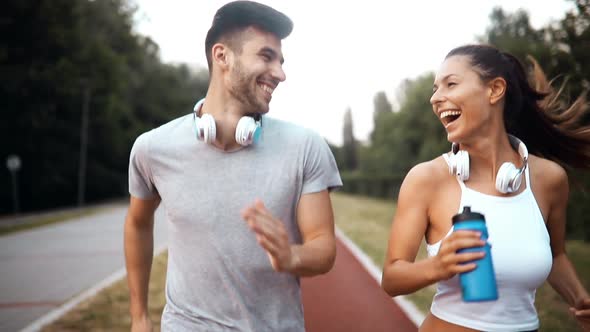 Beautiful Couple Jogging and Fitness Training Outdoor